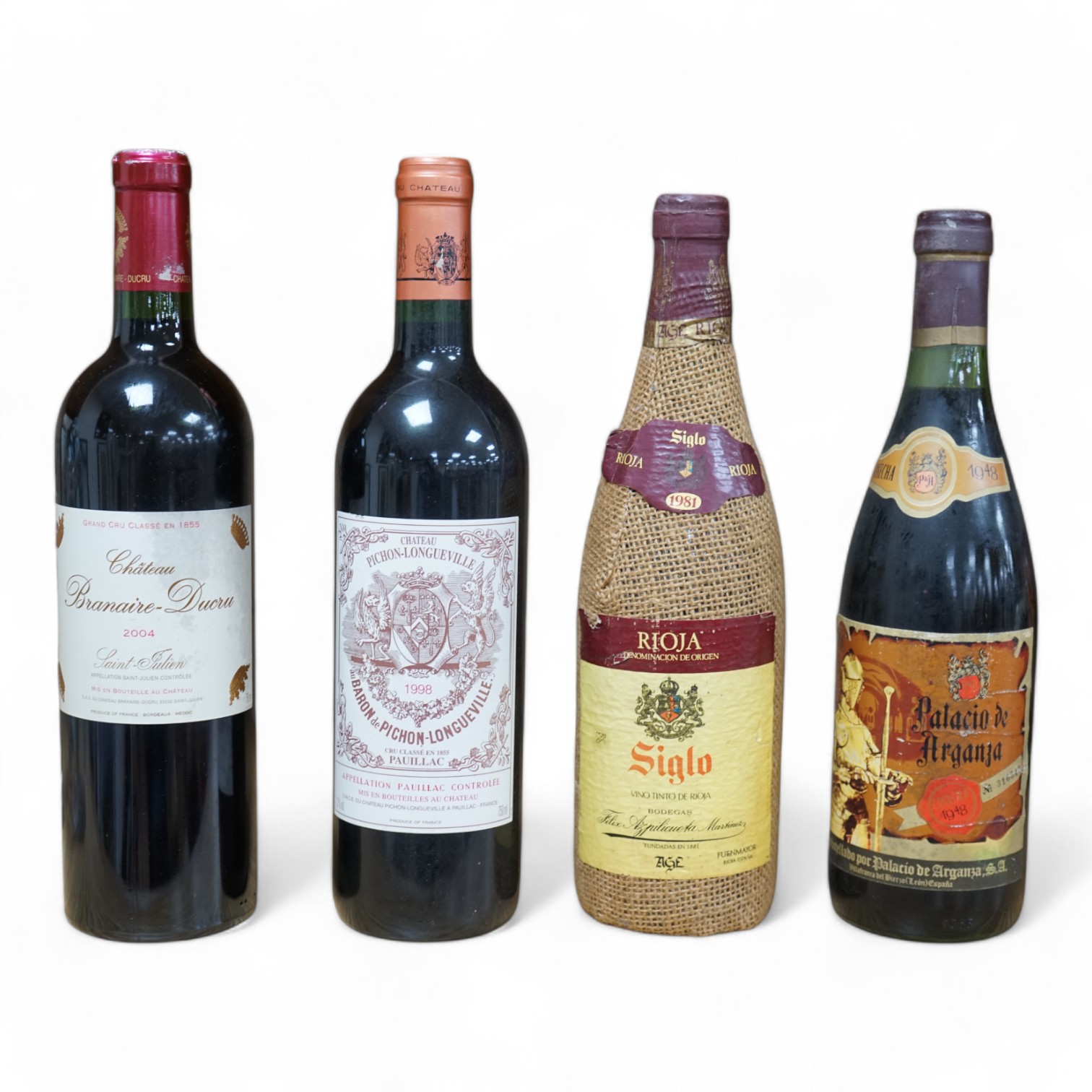 Four bottles of mixed wine to include Chateau Pichon Longueville 1998 and Chateau Branaire-Ducru 2004. Condition - fair, storage history unknown